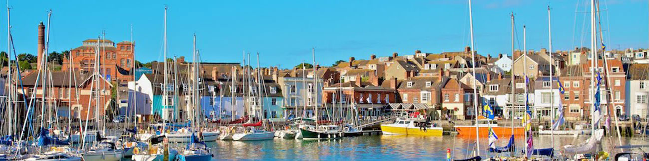 Dorset west sailing boats in harbour